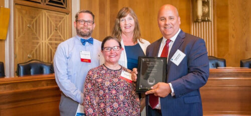 Kirby, Dena, and Lisa receive Home First award at US Capitol