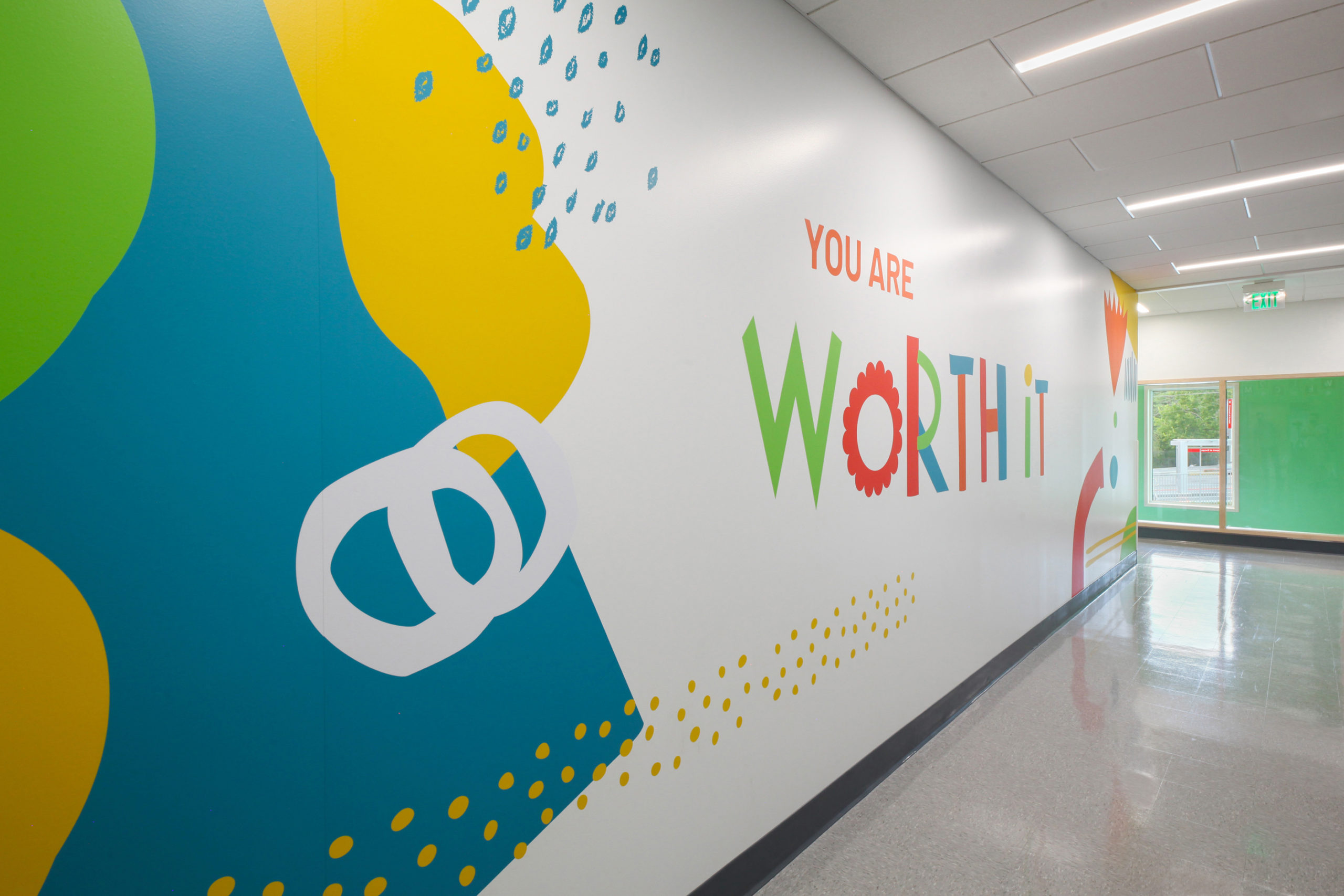 Colorful hallway with text that reads 