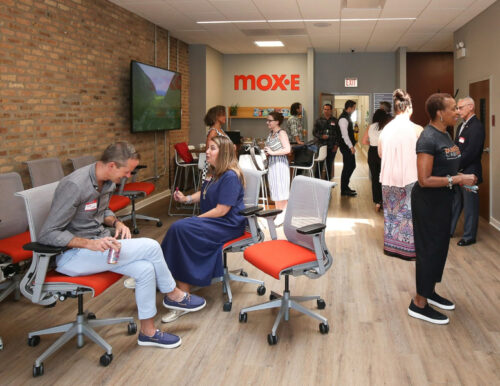 A networking event for entrepreneurs in the Mox.E coworking space at Entrenuity's headquarters in Chicago's South Loop neighborhood