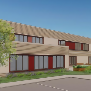 A digital rendering of a modern two-story building with a mix of brick and beige horizontal siding. The front left corner features a red brick facade with a flat canopy above a glass entrance door. The building's facade includes several rectangular windows with red panels between them. The surrounding landscape is neatly maintained, featuring green grass, shrubs, and a small tree. In the background, part of the side wall displays a colorful mural. Two silhouetted figures are walking along the sidewalk in the foreground, with a detached house visible further to the left against a bright blue sky.