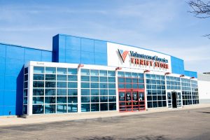 Exterior of a Volunteers of America Thrift Store with blue and white facade.